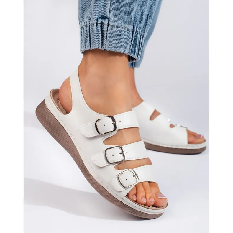 Comfortable white sandals with a low wedge